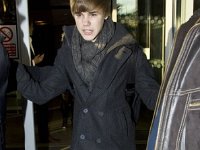 Justin Bieber  Justin Bieber wearing black low cut chucks.