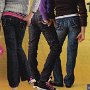 Ads for Levis and Jeans  Ad for designer jeans with black and black and pink 2-tone high top chucks.