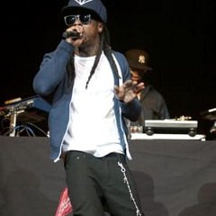 Lil Wayne  Lil Wayne on stage in navy blue chucks.
