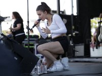 Meg Myers  Meg on stage performing in her monochrome white leather high top chucks.