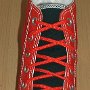 Narrow Round Shoelaces  Red and black 2-tone high top with narrow red laces.