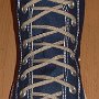 Narrow Round Shoelaces  Navy blue high top with narrow tan laces.