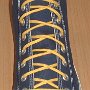 Narrow Round Shoelaces  Navy blue high top with narrow yellow laces.