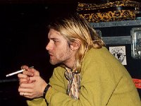 Kurt Cobain and Nirvana  Color shot of Kurt Cobain wearing black chucks.