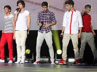 One Direction  Liam Payne wearing optical white and Harry Styles wearing red low cut chucks.
