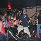 Outl4w  The band performing wearing high top chucks.