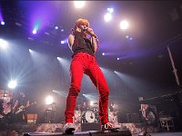 Paramore  Hayley Williams in concert wearing a pair of red high top chucks, shot 2.
