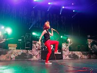 Paramore  Hayley Williams in concert wearing a pair of red high top chucks, shot 1.