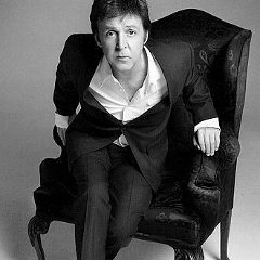 Paul McCartney  Black and white chucks in a black and white setting.