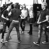 R5  Black and white casual photo of the band members all wearing black high and low top chucks.
