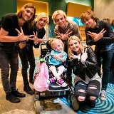 R5  The band with a young fan.