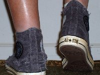 The Ramones High Top Chucks  Stepping out in a pair of Ramone's high tops with hemp laces, rear view.