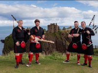 Red Hot Chili Pipers  Four band members at the Scottish coast.