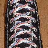 Red, White and Blue Shoelaces  Black high top chuck with red, white and blue weave shoelaces.