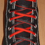 Reversible Shoelaces On Chucks  Black high top with black and red reversable laces.