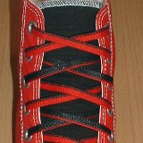 Reversible Shoelaces On Chucks  Red and black 2-tone high top with black and red reversable laces.