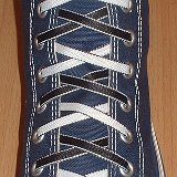 Reversible Shoelaces On Chucks  Navy blue high top with black and white reversable laces.