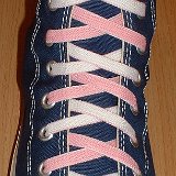 Reversible Shoelaces On Chucks  Navy blue high top with pink and white reversable laces.