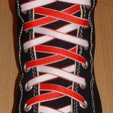 Reversible Shoelaces On Chucks  Black high top with red and white reversable laces.