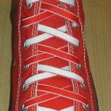 Reversible Shoelaces On Chucks  Red high top with red and white reversable laces.
