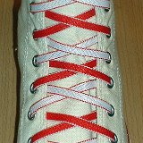 Reversible Shoelaces On Chucks  Optical white high top with red and white reversable laces.