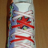 Reversible Shoelaces On Chucks  White graffiti high top with red and white reversable laces.