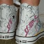 Rock and Roll High Top Chucks  Wearing white punk print high tops, rear view 1.
