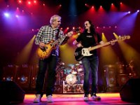 Rush  Geddy Lee, in white chucks with black laces, and guitarist Alex Lifeson rock on.