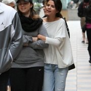 Selena Gomez  Walking through a mall.