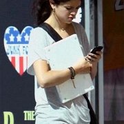 Selena Gomez  Selena texting in her navy blue chucks.