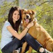 Selena Gomez  Selena with her best friends, a dog and black low top chucks.