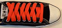 Orange retro shoeaces on black low top