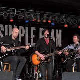 Simple Plan  Jeff Stinco and others strumming their guitars.