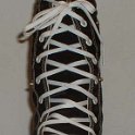 Skate Shoelaces on Knee High Chucks  White 96 inch shoelaces on a left black knee high.