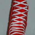 Skate Shoelaces on Knee High Chucks  White 84 inch shoelaces on a right red knee high.