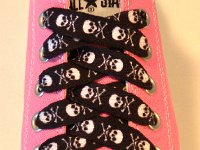 Skull Print Shoelaces On Chucks  Black and white skull print shoelace on a pink low cut.