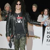 Slash  Slash arriving at the UK Music Hall Of Fame in 2005. : EOS1DMkII-238111, Guns, N, Roses, Cigarette, Cigarettes, Sneakers, Sneaker, Shoe, Trainers, Accessories, Trousers, Military, Style, Jacket, Red, Carpet, Green, Black