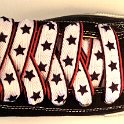 Star Print Shoelaces on Chucks  Black high top chuck with black, white and red star print shoelaces.