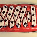 Star Print Shoelaces on Chucks  Red high top chuck with black, white and red star print shoelaces.