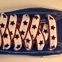 Star Print Shoelaces on Chucks  Royal blue high top chuck with black, white and red star print shoelaces.
