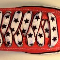 Star Print Shoelaces on Chucks  Red low top chuck with black, white and red star print shoelaces.