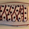 Star Print Shoelaces on Chucks  Optical white low top chuck with black, white and red star print shoelaces.