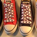 Star Print Shoelaces on Chucks  Core color low top chucks with black, white and red star print shoelaces.