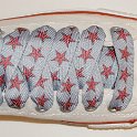 Star Print Shoelaces on Chucks  Optical white low top chuck with red and silver star print shoelaces.
