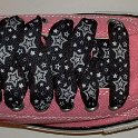Star Print Shoelaces on Chucks  Pink low top chuck with black and silver star print shoelaces.