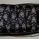 Star Print Shoelaces on Chucks  Black high top chuck with black and silver star print shoelaces.