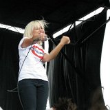 Tonight Alive  Jenna McDougall on stage wearing black high top chucks.
