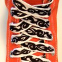 Tribal Band Shoelaces on Chucks  Tribal band print shoelace on an orange high top chuck.