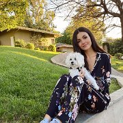 Victoria Justice  Victoria Justice takes  seat with her dog.