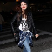Victoria Justice  Justice wears black and white polka dot print chucks while walking down the street.